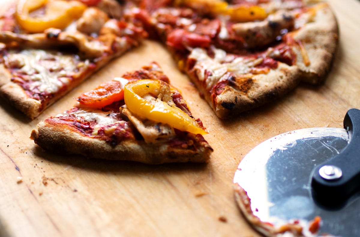 A slice of pizza reheated to crisp-and-melty — the toaster oven's daily job, done better by steam